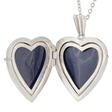 A mid-20th century, silver, engraved, heard shaped locket & chain