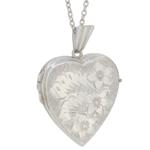 A mid-20th century, silver, engraved, heard shaped locket & chain