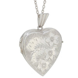 A mid-20th century, silver, engraved, heard shaped locket & chain