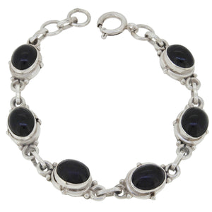 A modern, silver, black onyx set, in-line bracelet.