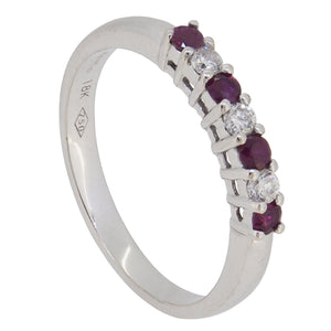 A modern, 18ct white gold, ruby & diamond set, seven stone half eternity ring.