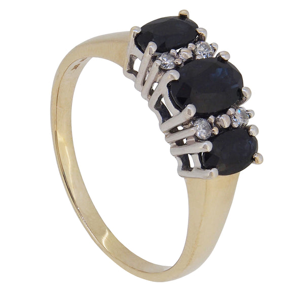 A modern, 9ct yellow gold, sapphire & diamond set seven stone ring.