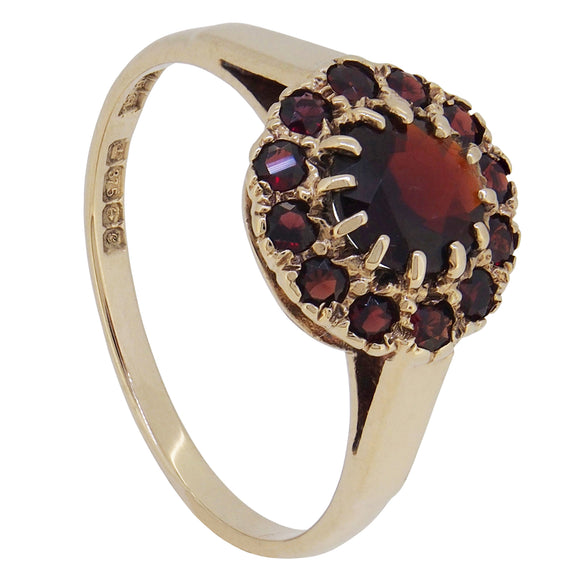 A modern, 9ct yellow gold, garnet set cluster ring.