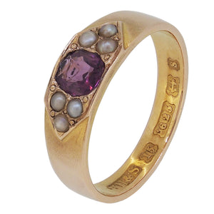 An early 20th century, 15ct yellow gold, almandine garnet & seed pearl set seven stone ring.