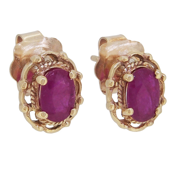 A pair of modern, 9ct yellow gold, ruby & diamond set stud earrings