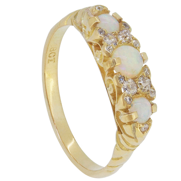 An Edwardian, 18ct yellow gold, opal & diamond set carved half hoop ring.