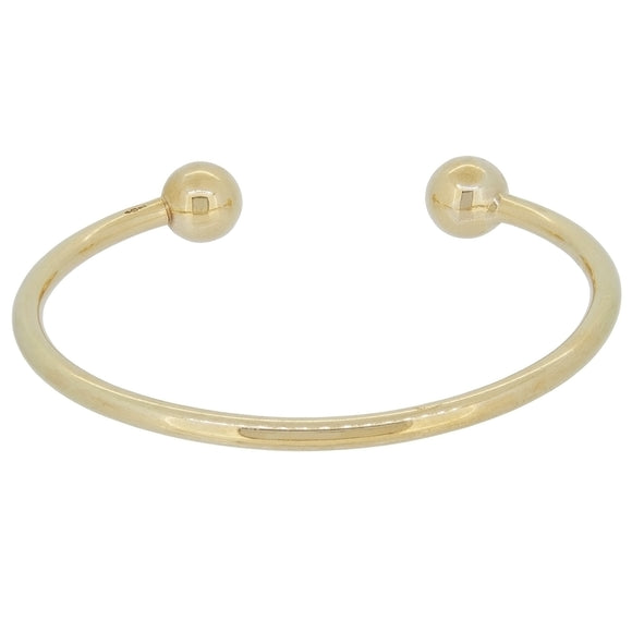 A modern, 9ct yellow gold torque bangle.