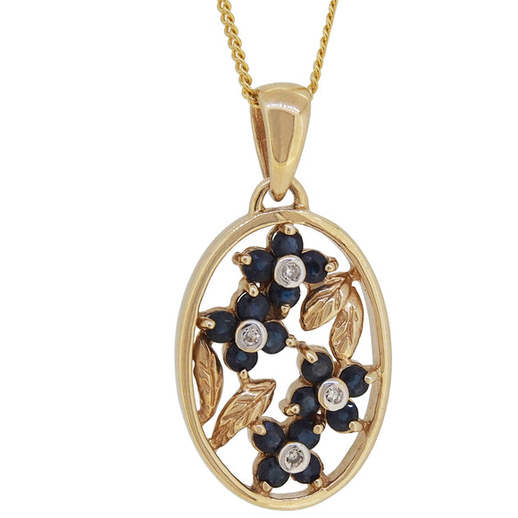 A modern, 9ct yellow gold, sapphire & diamond set floral pendant & chain.