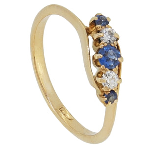 An Edwardian, 18ct yellow gold, sapphire & diamond set, five stone crossover ring.