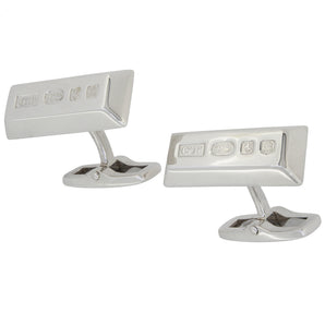 A pair of modern, silver, oblong ingot bar link cufflinks with feature hallmarks.