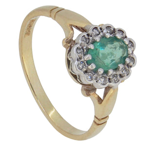 A modern, 9ct yellow gold, emerald &amp; diamond set, oval cluster ring.