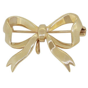 A mid-20th century, 9ct yellow gold bow brooch.