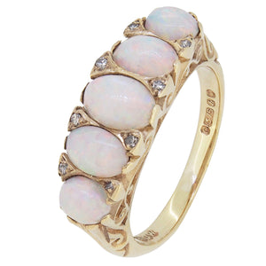 A mid-20th century, 9ct yellow gold, opal &amp; diamond point set, carved half hoop ring.