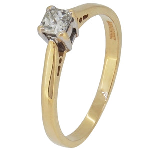 A modern, 18ct yellow gold, princess cut diamond set ring.