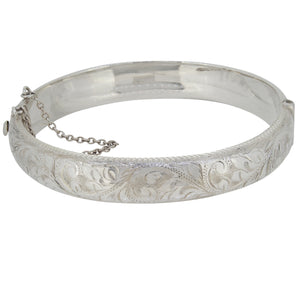 A modern, silver, half engraved hinged bangle.