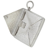 An early 20th century, silver, envelope stamp case pendant.