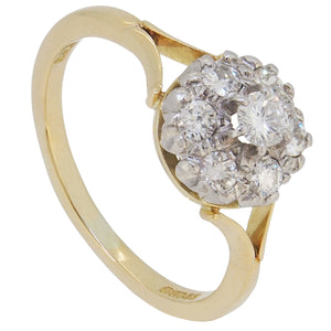 A modern, 18ct yellow gold, diamond set, seven stone cluster ring.