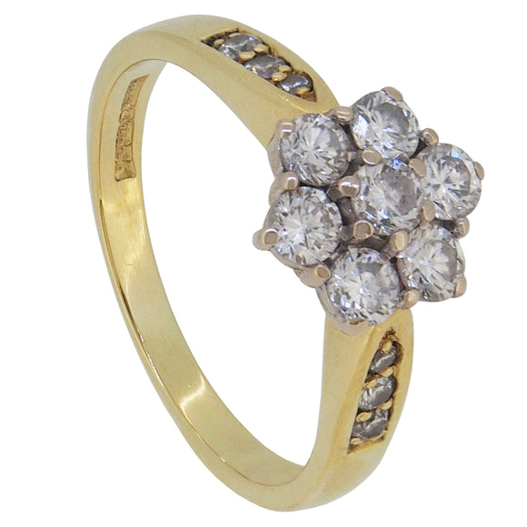 A modern, 18ct yellow gold, diamond set cluster ring.