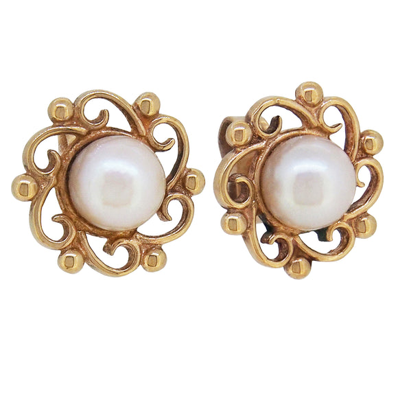 A pair of modern, 9ct yellow gold, pearl set, open work earrings.