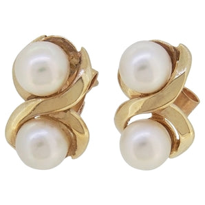 A pair of modern, 9ct yellow gold, pearl set, figure of eight stud earrings.
