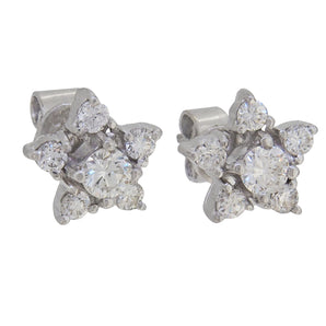 A pair of modern, 9ct white gold, diamond set, star cluster stud earrings.