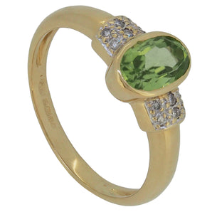A modern, 18ct yellow gold, peridot & diamond set, nine stone ring.