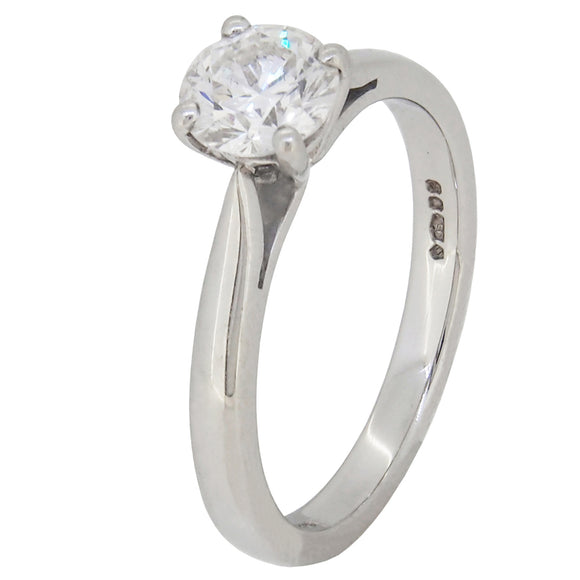 A modern, platinum, diamond set, single stone, solitaire ring