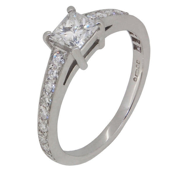 A modern, platinum, diamond set solitaire ring