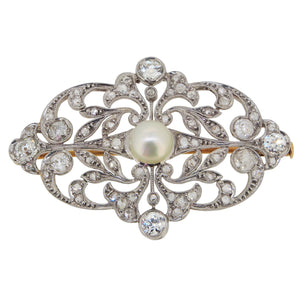 A platinum, diamond & pearl set, open work brooch with a yellow gold pin