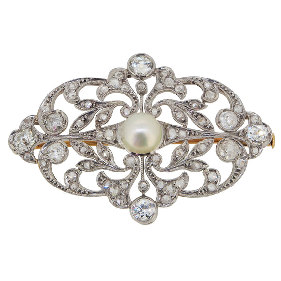 A platinum, diamond & pearl set, open work brooch with a yellow gold pin