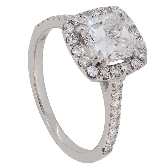 A modern, 18ct white gold, cushion cut diamond set, halo cluster ring