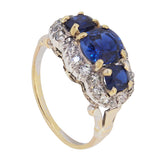 An early 20th century, 18ct gold, sapphire & diamond set triple cluster ring.