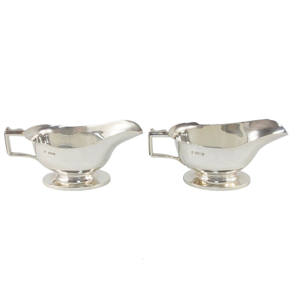 A pair of mid-20th century, silver sauce boats