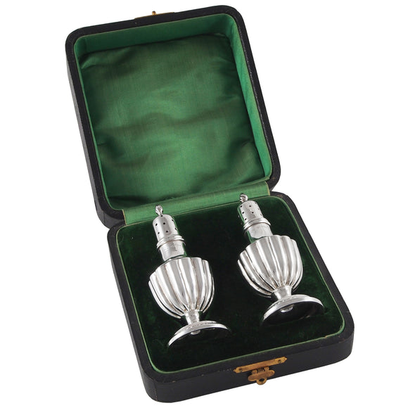 A pair of Edwardian, silver pepper pots & fitted case