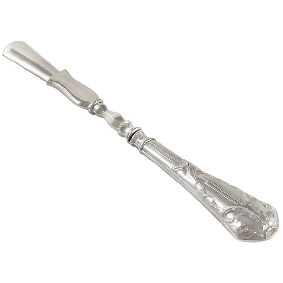 A white metal cuticle pusher