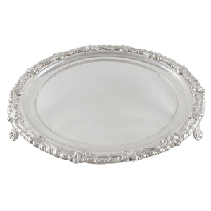 A Georgian, silver, circular salver on three feet