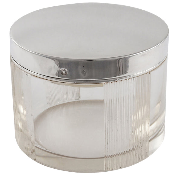 An early 20th century glass jar with a silver lid & insert