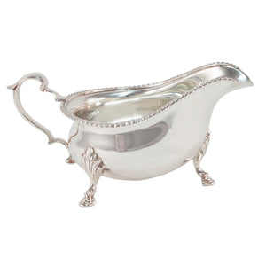 A mid-20th century, silver gravy boat