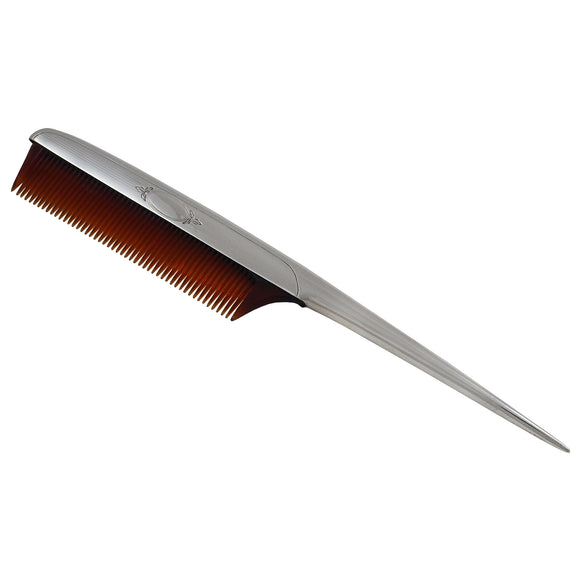 A white metal tail comb