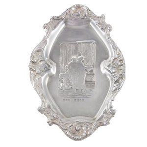 A Victorian, silver pin tray with a scene depicting a man & woman