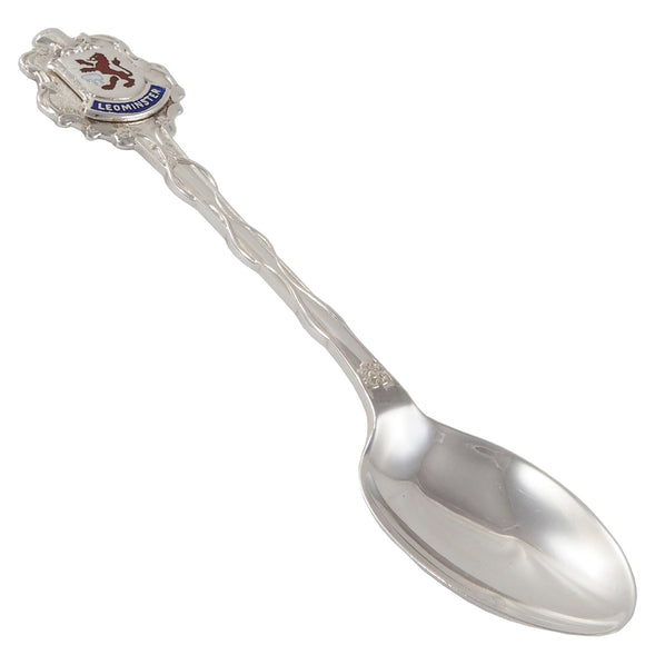 A mid-20th century, silver, enamel set souvenir teaspoon featuring a crest of Leominster