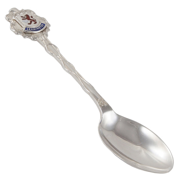 A mid-20th century, silver, enamel set souvenir teaspoon featuring a crest of Leominster.