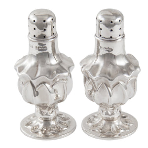 A pair of Edwardian, silver pepper pots