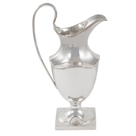 An Edwardian, silver cream jug on a square base