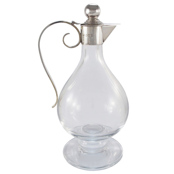 A Victorian, plain glass claret jug with a silver mount & handle