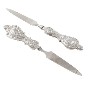 A pair of Edwardian, silver handled nail files