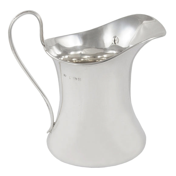 An early 20th century, silver cream jug