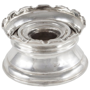An early 20th century, silver, castellated tower inkwell with a clear glass liner