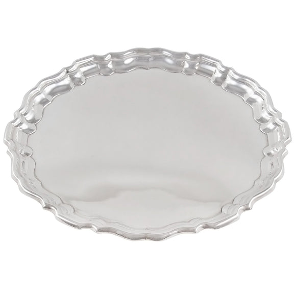 A modern, silver, circular card tray