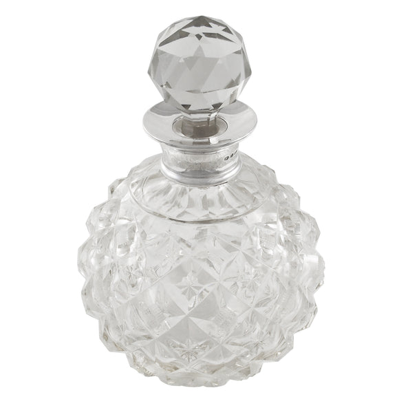An early 20th century, glass scent bottle with a silver mount & glass stopper